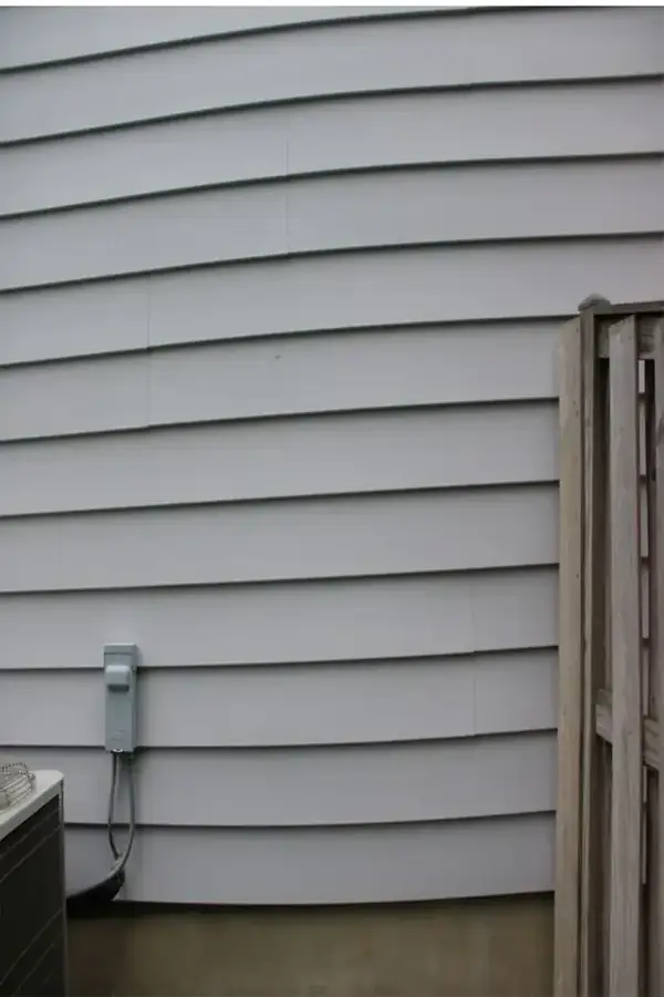 After: the same cladding after a low-pressure wash